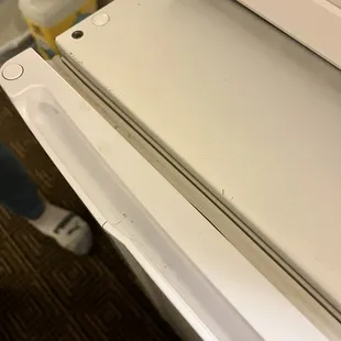 Dirt and particles all the way around the seal of the fridge.