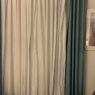 Wrinkled and torn window dressing