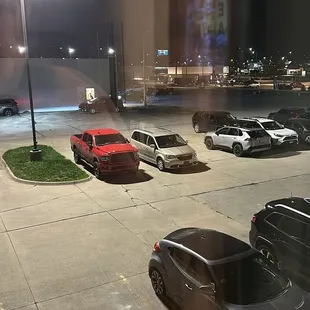 Parking lot which has plenty of parking and is well lit.