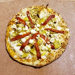 a pizza on a pizza board