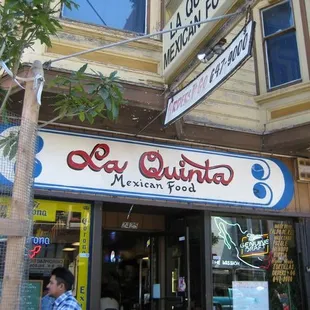a man walking in front of the restaurant