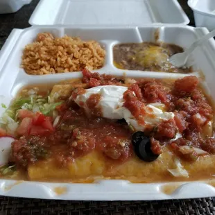 3 enchiladas after I smothered them with salsa &amp; sour cream