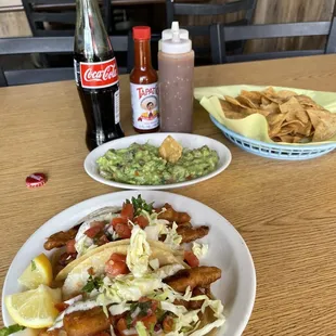 Fish tacos, Side of Chips and Guacamole and a Mexican Coke