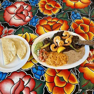 a plate of shrimp and rice
