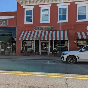 a car parked in front of the restaurant