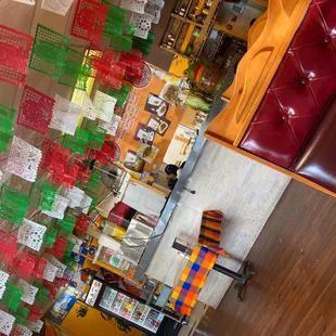 a room with a lot of mexican paper decorations