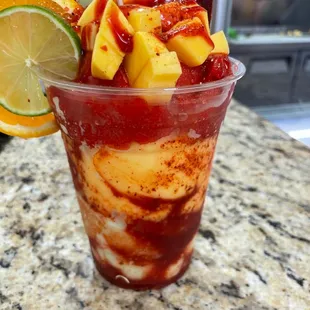 a cup of ice cream and fruit