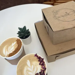 Two of their signature lattes, plus our boxed pastry haul to go!