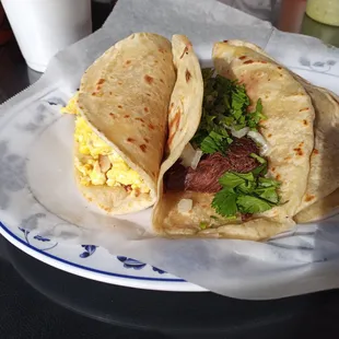 Bacon and egg taco, shredded beef taco, and barbacoa taco