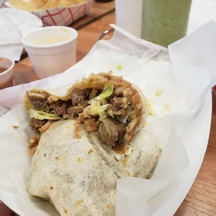 Huge Steak burrito delicious. (Steak, rice, beans, lettuce and cheese)