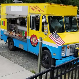 a yellow and blue food truck