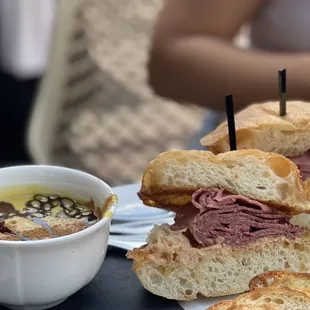 a plate of sandwiches and a bowl of soup