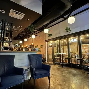 two blue chairs in a restaurant