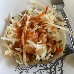 Pupusa with the cabbage and sauce.