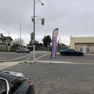Parking lot of the Pupusa truck next to a hair salon