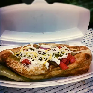 a hot dog with toppings