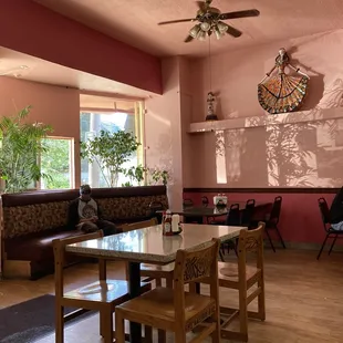 a dining area with a table and chairs