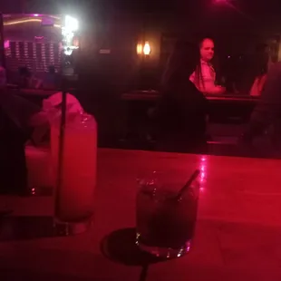 a woman sitting at a bar