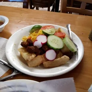 Yuca Con chicharron plate.  Food is always delicious. Great prices.