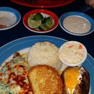 Fish and shrimp a la roca feller with white rice and a baked potato