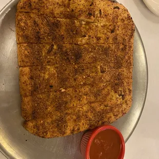 Pull-A-Part - Freshly made bread sticks seasoned with fresh garlic slices, olive oil, Parmigiano cheese, a spice blend; marinara sauce