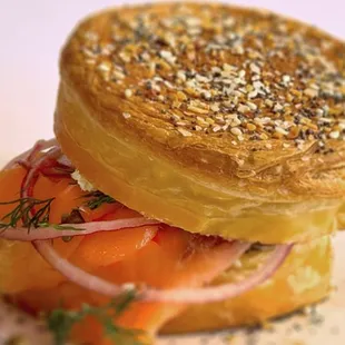 The &quot;Salmone&quot; sandwich with smoked salmon, creamy tzatziki cream cheese, onion, fresh dill, crispy fried capers, served on New York Roll.