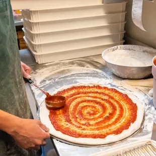 a person making a pizza