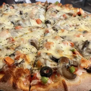 Medium veggie pizza fresh out of the oven