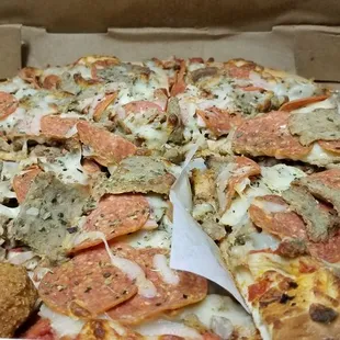 Now THAT&apos;S a pizza! All meat with gyro on top, stacked nice and high.