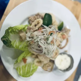 Calamar Frito (Fried Calamari, served with marinate onions and tarta sauce).