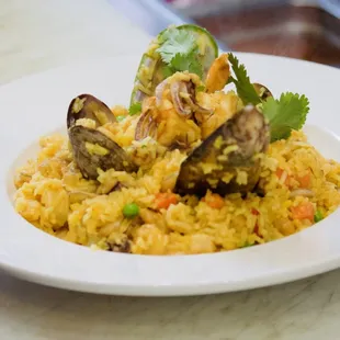Arroz Con Marisco is a plate with clams, mussels, shrimp and calamari.