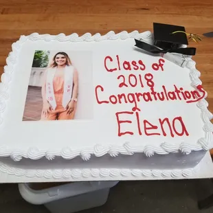 a graduation cake with a picture of a graduate