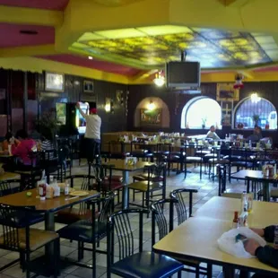 a man sitting at a table in a restaurant