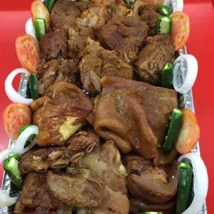 a platter of meat and vegetables