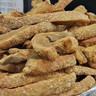 a pile of fried chicken strips