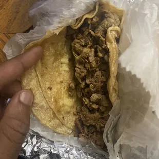 Steak tacos with cilantro and onion