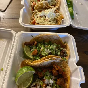 Tacos al pastor on the bottom and Chicken deluxe (especial) top