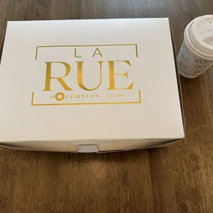 La Rue pastry box with a Black Forest latte