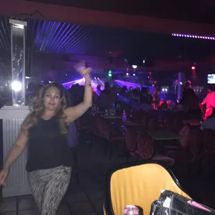 a woman holding a remote control