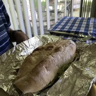 a sandwich wrapped in foil