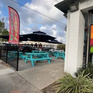 Tables with patio umbrellas , Banner and paintings