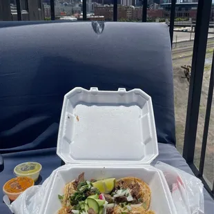 a taco in a styrofoam container