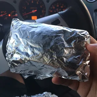 Instead of on a plate, this is the way they come after waiting an hour for tacos