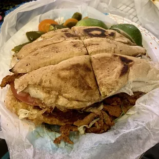 a sandwich with meat and vegetables