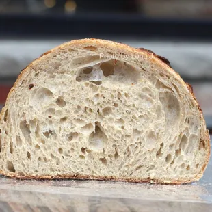 The Sourdough Bread ($6.00 for half loaf) - good. Nice light, chewy texture. Tastes quite &quot;white&quot;: made w/ bread and stone ground ww flour