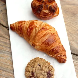 Kouign-Amann ($5.20), French Croissant ($4.70), Cherry Oat Cookie ($3)