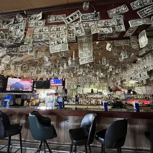 a lot of money hanging from the ceiling