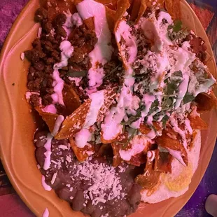 Chilaquiles rojos with chorizo.  And 2 huevos over medium.  And some frijoles.   Was eh good enough.  Slightly above par.