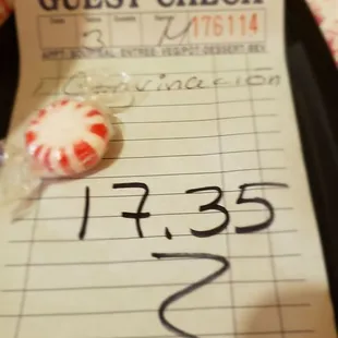 a check and a lollipop