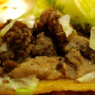 Steak tostada has seasoned moist steak